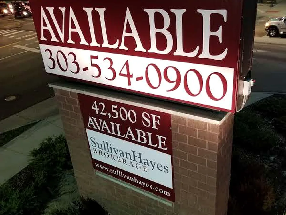 Two-sided commercial banner display photographed after installation