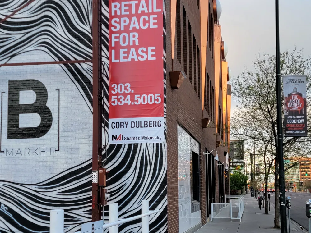 Commercial pole banner installed on dedicated street hardware