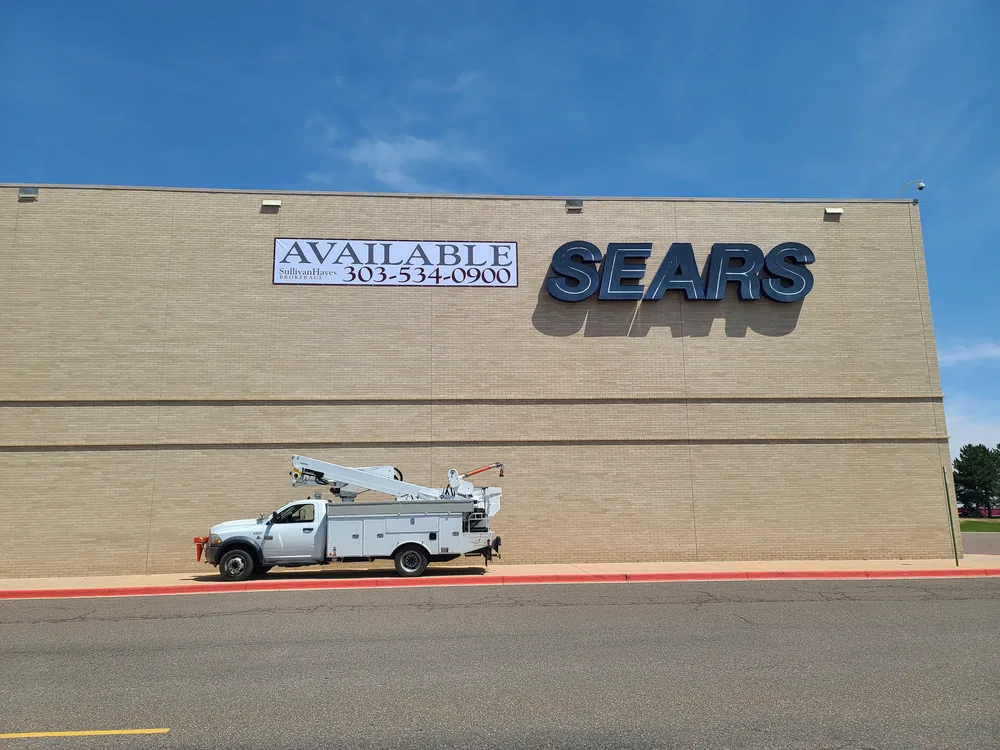 Retail building with two large vinyl banners