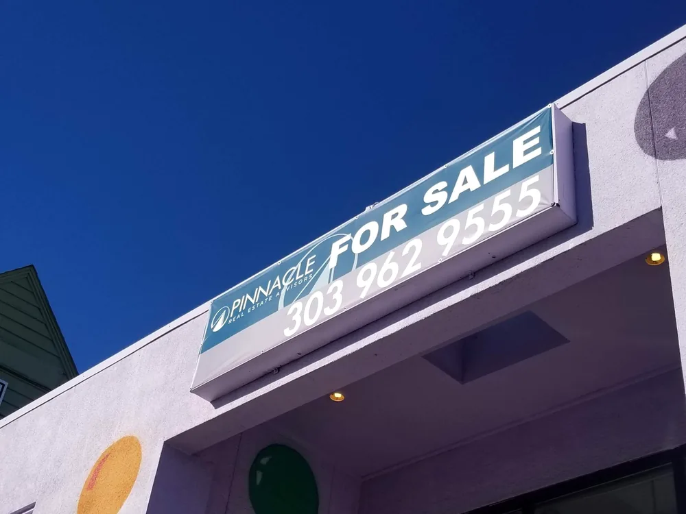 Commercial banner mounted on a building wall