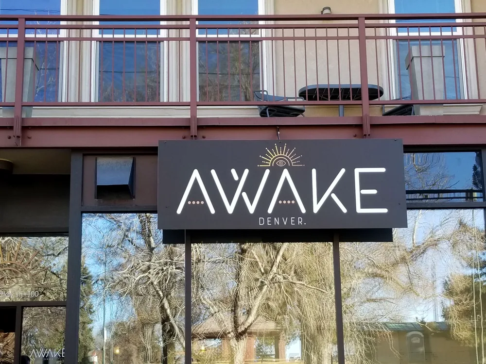 Custom building identification sign installed over a commercial entrance
