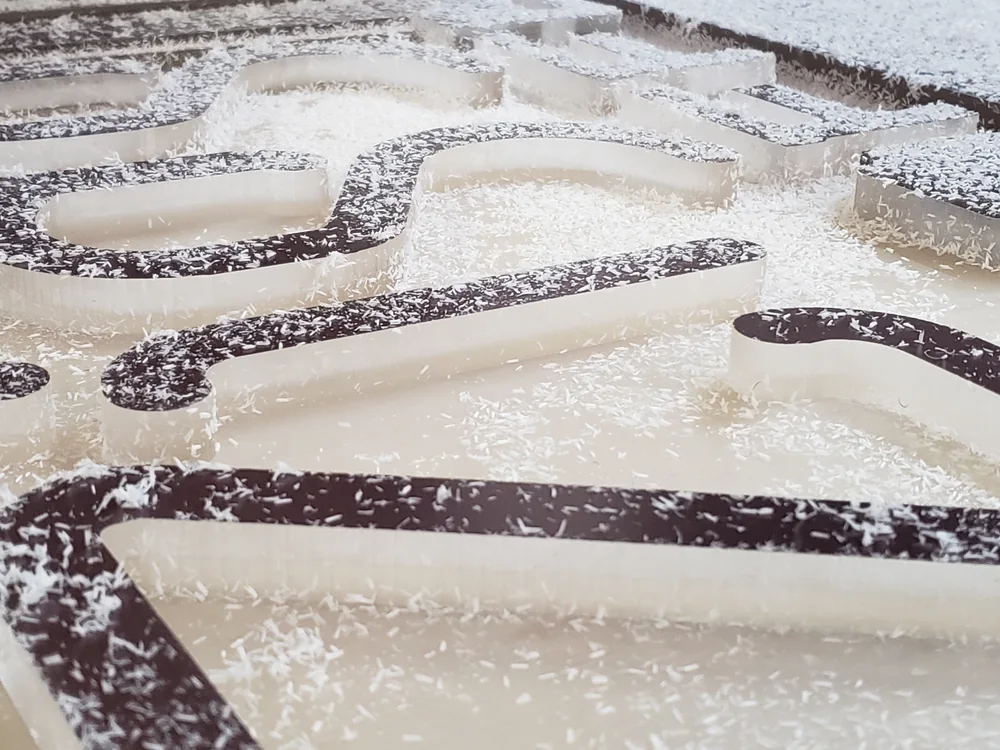 CNC routing dimensional letter material in the S2 shop
