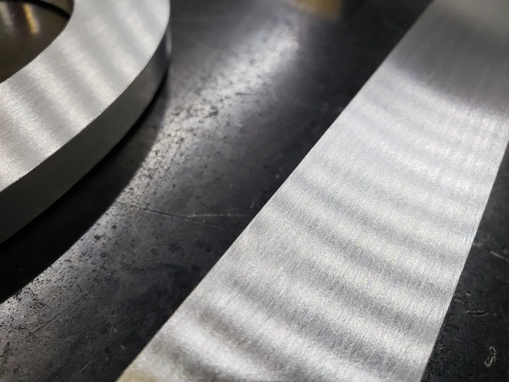 Brushed aluminum dimensional letter finish detail