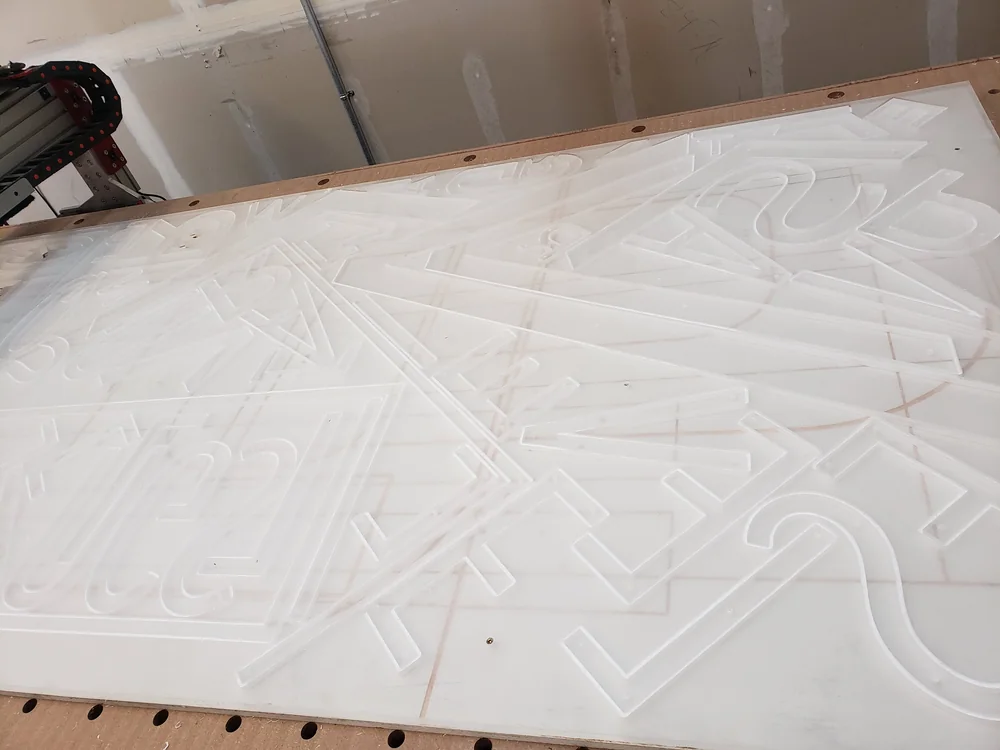 CNC routing a dimensional relief sign in the S2 shop