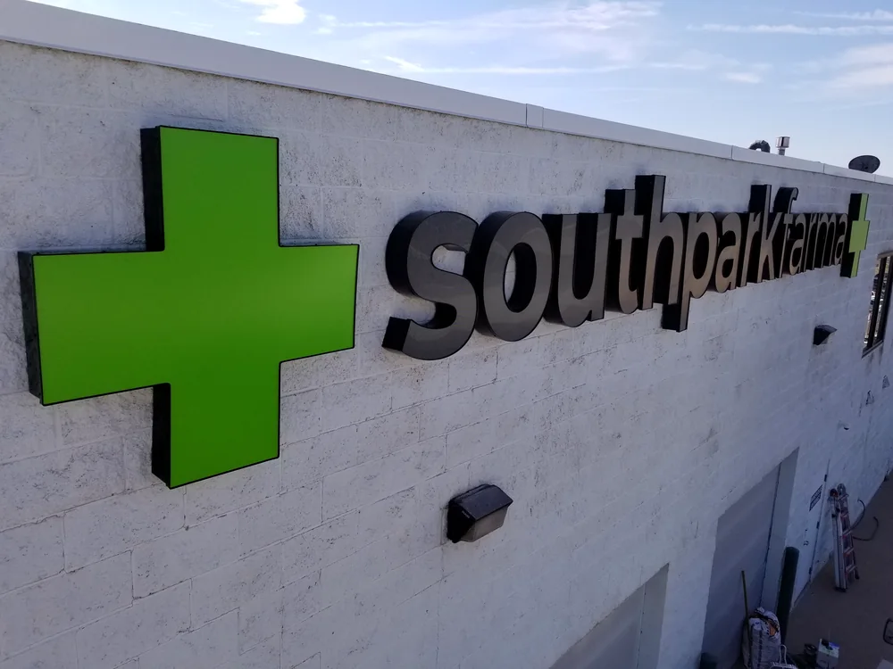 Front-lit channel letters with black perforated faces at South Park Farma in Denver