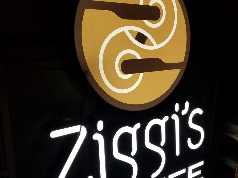 Front-lit Ziggi's Coffee channel letters illuminated at night in Hudson, Colorado
