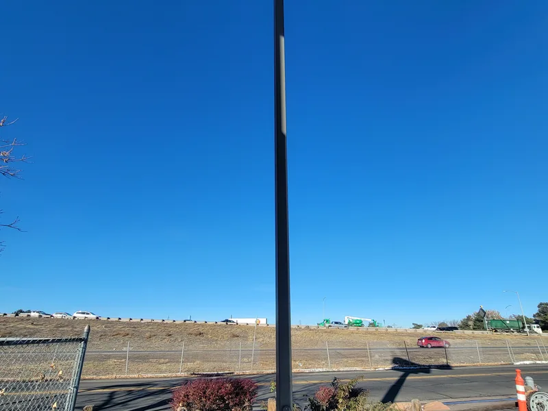 Two parking lot fixtures with one light not operating