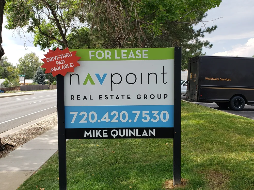 Framed commercial sign panel installed by S2
