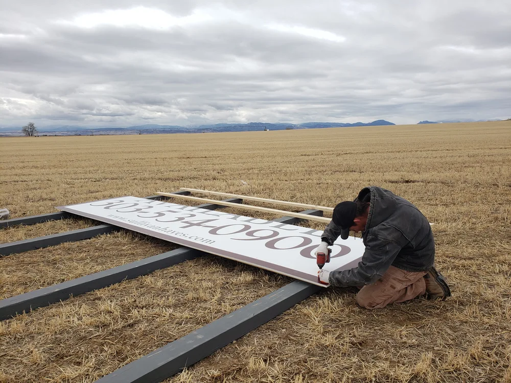 Large sign panel being assembled in the field