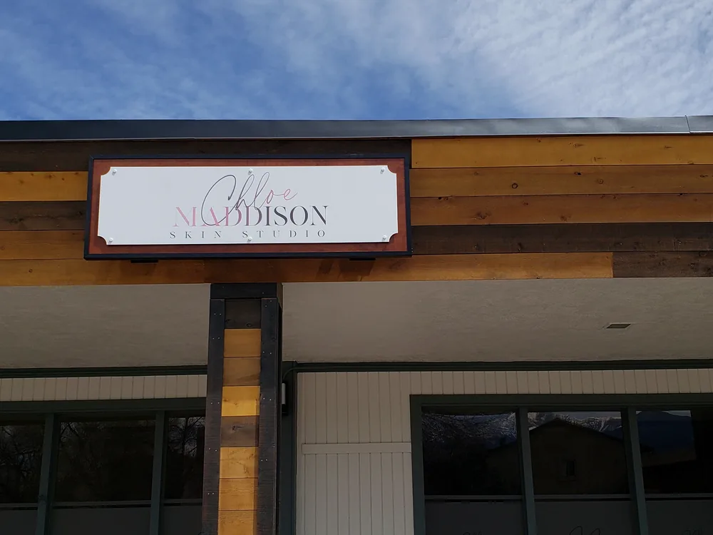 Non-illuminated tenant wall sign installed by S2