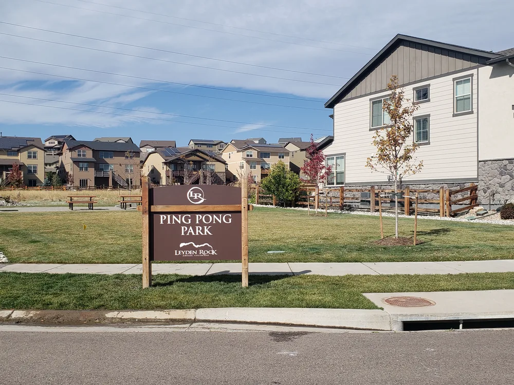 Community directional sign installed near a roadway