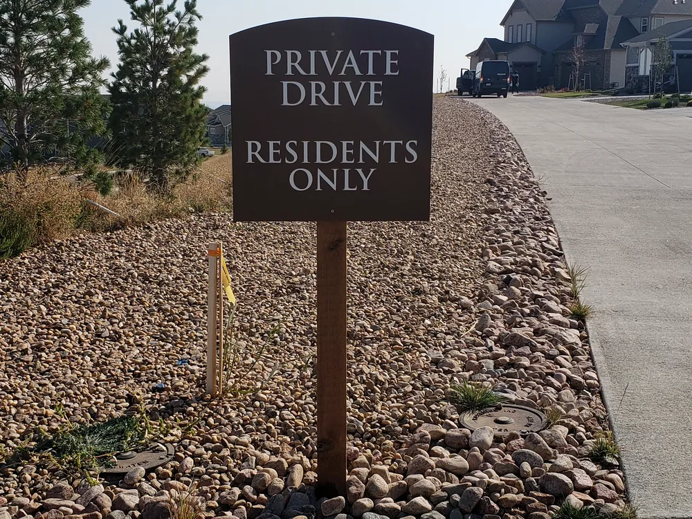 Pedestrian directional sign installed along a pathway